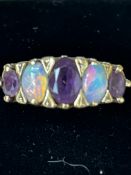 9ct Gold ring set with 3 amethyst & 2 opals Size Q