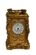 Miniature french gilt nude ladies carriage clock