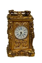 Miniature french gilt nude ladies carriage clock