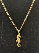 9ct Gold curb chain with seahorse pendant set with