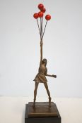 Bronze girl with ballons inspired by Banksy on mar