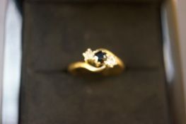 9ct gold ring with sapphire and two diamonds, size
