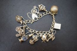 Silver charm bracelet with eleven charms