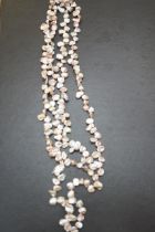 A silver clasp necklace of pearl stones