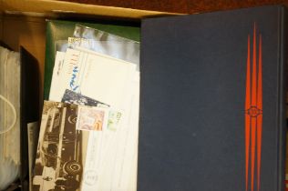 A Box containing a number of stamps contained in s