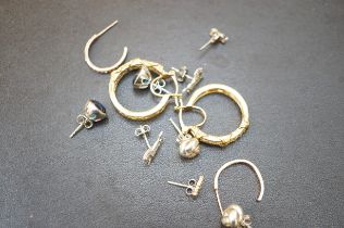 Six pairs of silver earrings