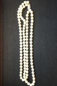 String of cultured pearls with sterling silver cla