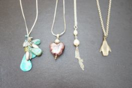 Four silver necklacea