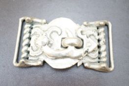 White metal buckle, possibly silver