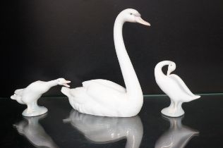 Three Lladro swans, tallest 22cm