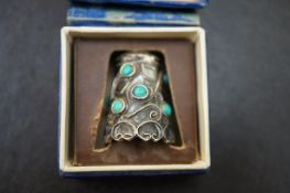 A boxed silver and turquoise thimble