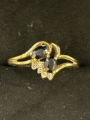 9ct Gold ring set with 2 sapphires & diamonds Size