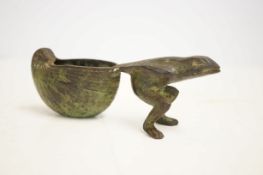 Early bronze frog pulling a shell 16 cm wide