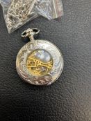 Skeletonised hand wound pocket watch in silver col