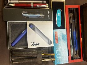 Victorinox blue pen knife & a collection of pens