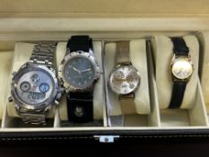 4 Fashion watches in a display case