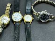 Four ladies mechanical watches, all working. To in