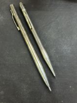 2 Silver propelling pencils