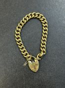 9ct Gold bracelet with heart shaped locket & safet