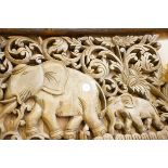 Wooden carved panel of 2 elephants