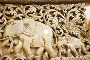 Wooden carved panel of 2 elephants