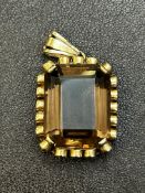 9ct Gold pendant set with smokey quartz Weight 8.7
