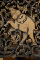 Carved wooden panel of elephant