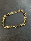 Yellow metal bracelet tested for hight carat gold