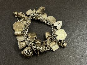 Silver charm bracelet 27 charms