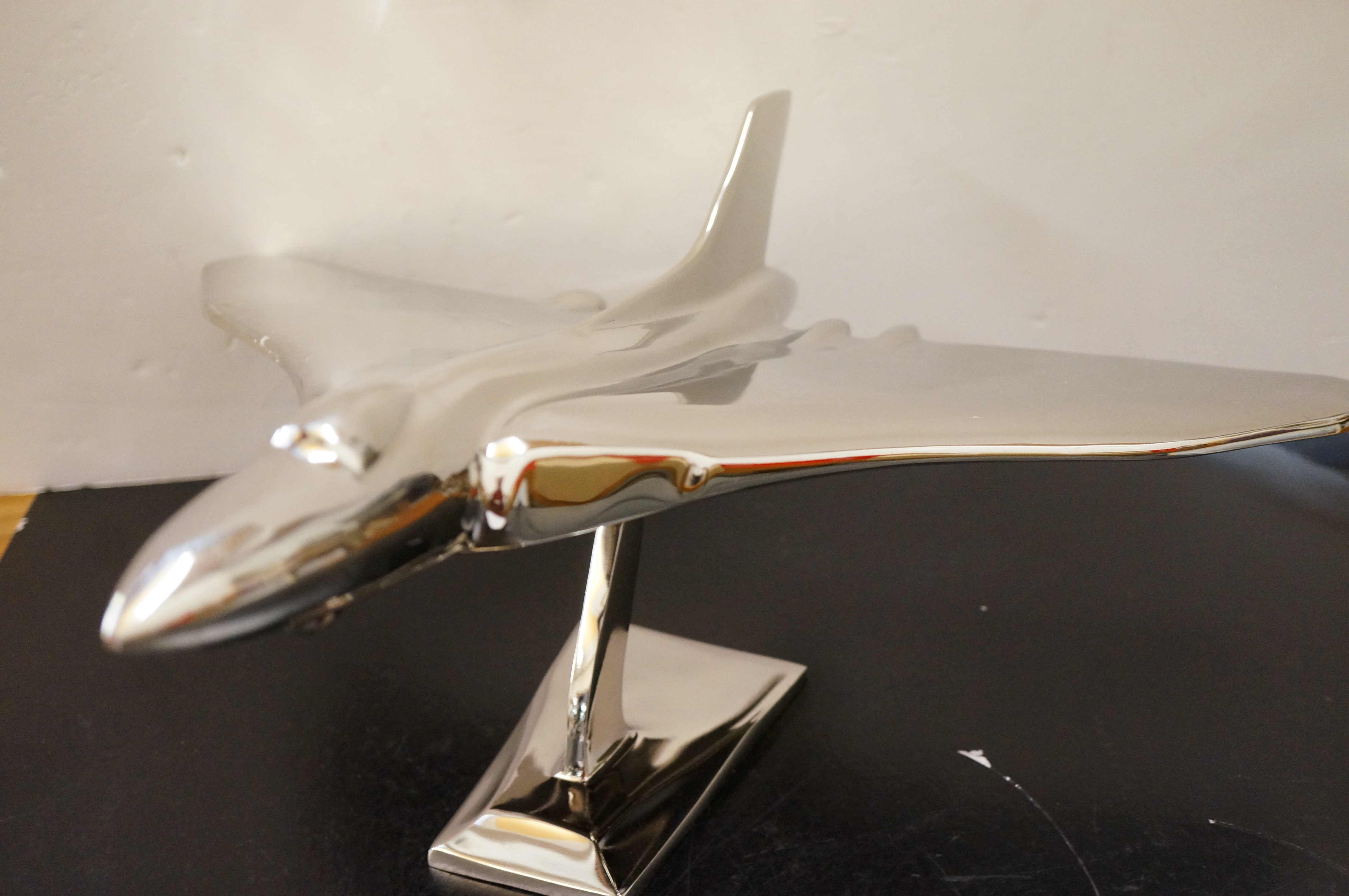 Large chrome vulcan bomber on stand