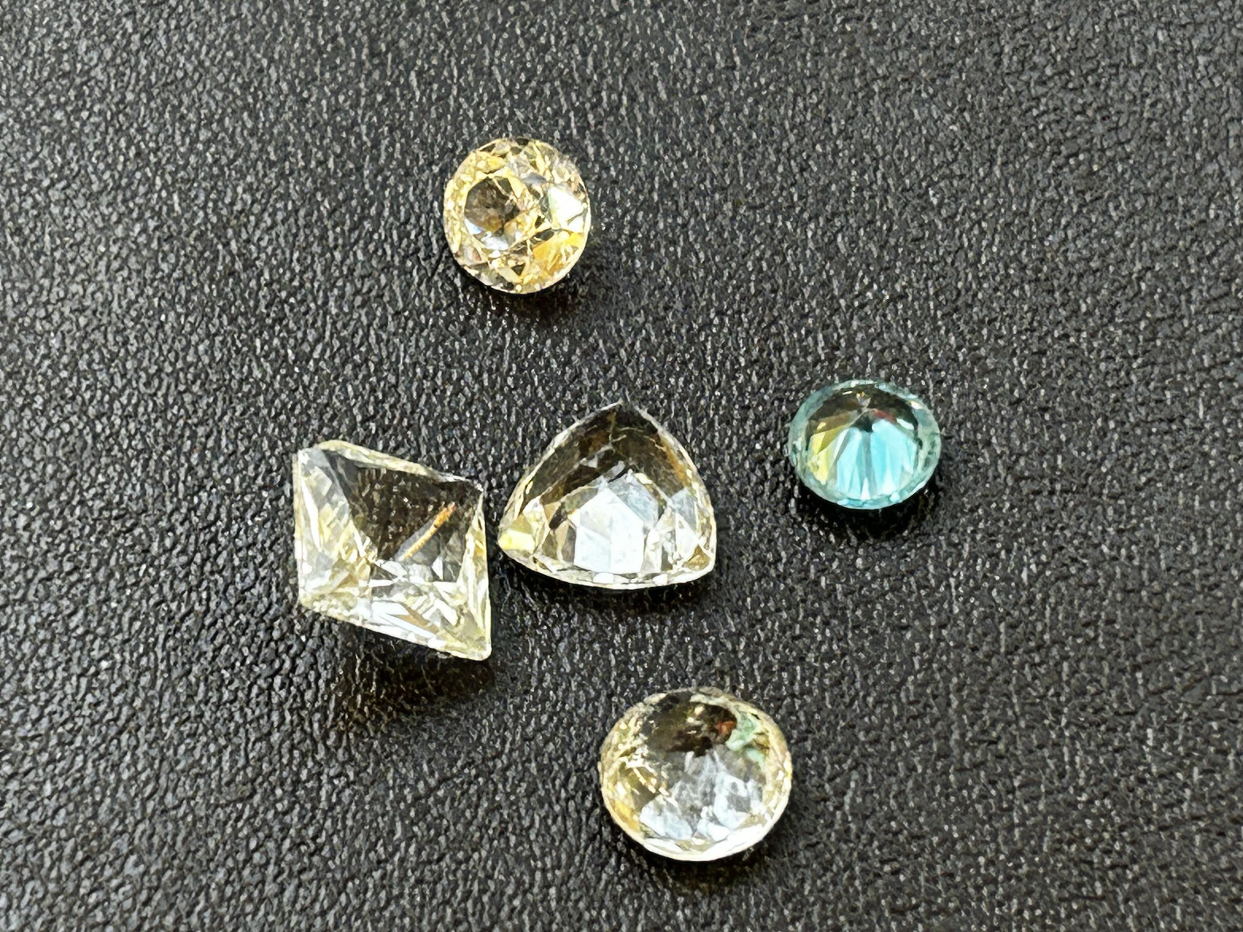 4 Clear stones & 1 blue stone