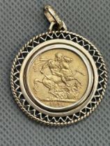 1875 Full Sovereign (Young head) with 9ct mount. 12.8 grams total weight
