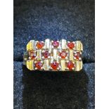 9ct Gold ring set with 10 garnets Size N Weight 5.
