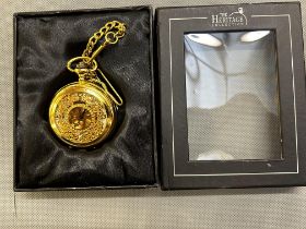 Gold coloured manual wind pocket watch on chain wi