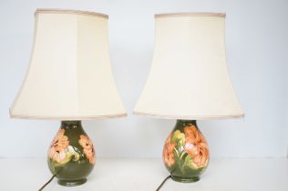 Pair of Moorcroft hibiscus pattern lamps with orig