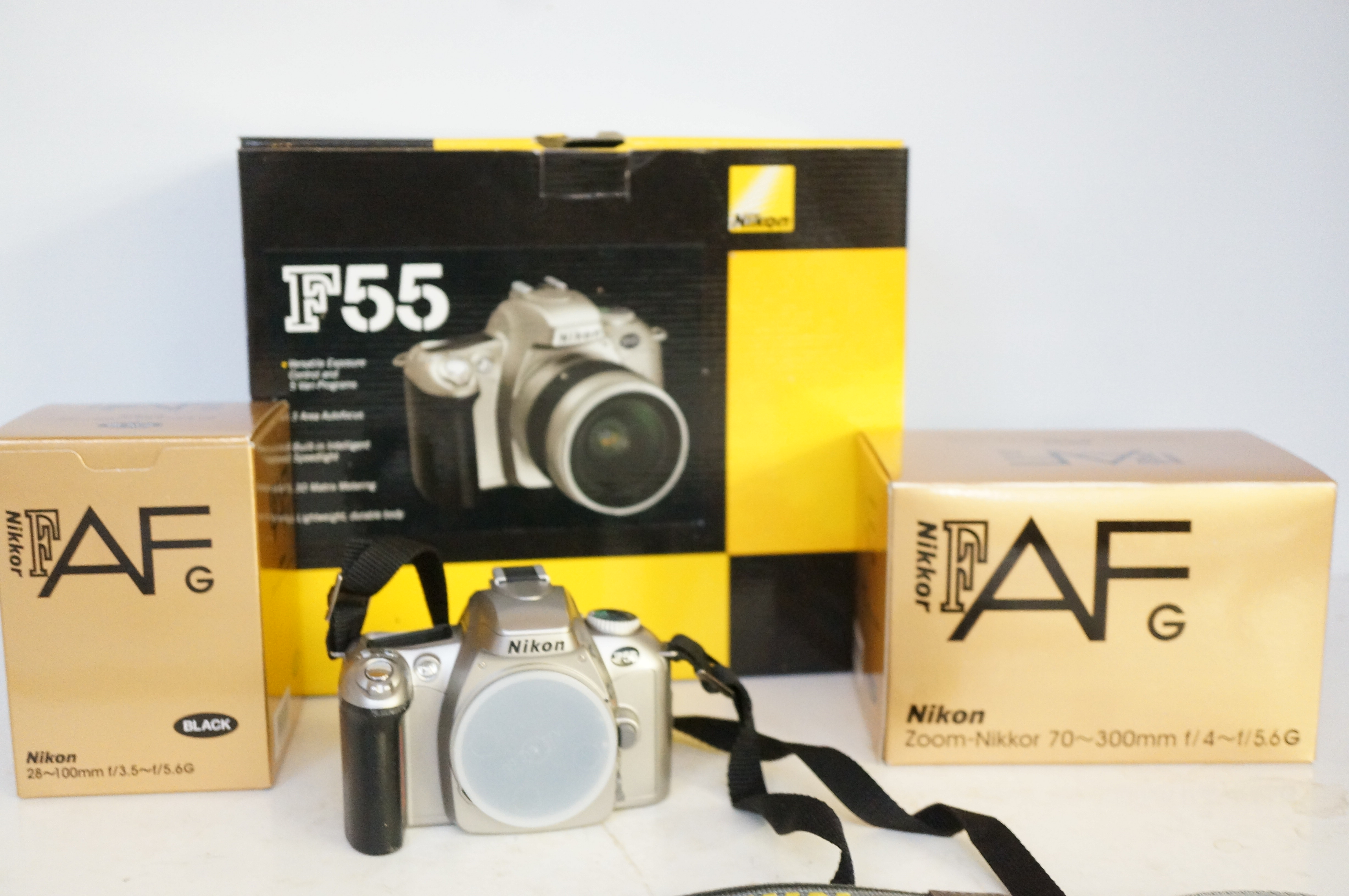 Nikon F55 camera with 2 boxed lenses