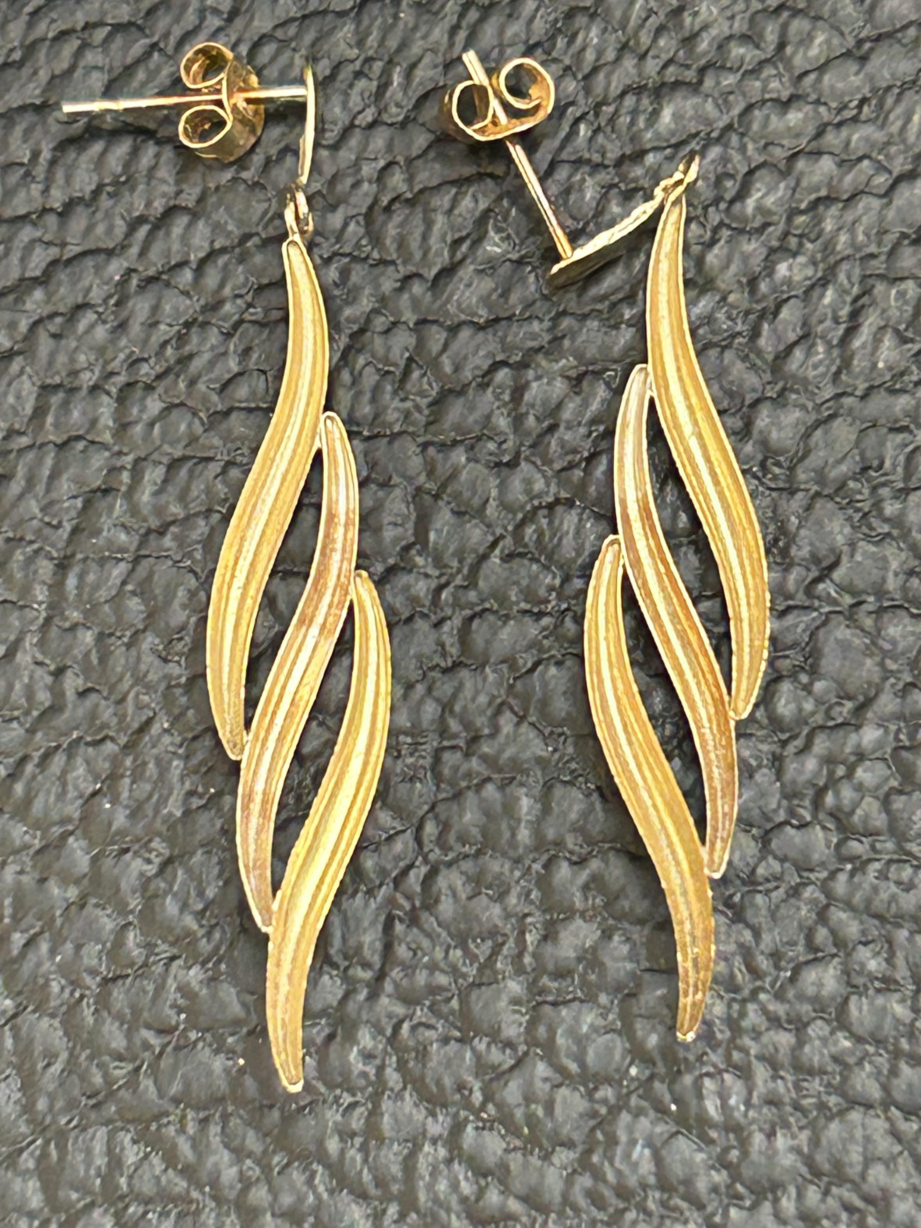 Pair of yellow metal earrings tested for gold