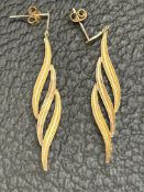 Pair of yellow metal earrings tested for gold