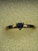 9ct Gold ring set with heart shaped blue stones Si
