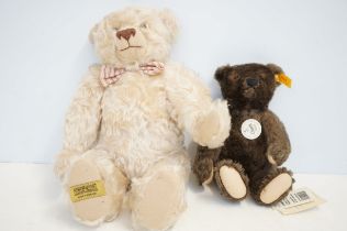 Steiff teddy bear with tags together with a Merryt
