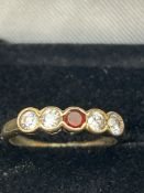9ct Gold ring set with garnet & 4 cz stones Size I