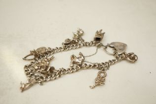 Silver charm bracelet - 11 charms