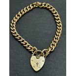 9ct Gold bracelet with heart locket and safety cha