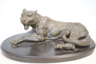 Heavy bronze model or a leopard on a marble base.