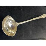Early white metal ladle with rats tail design, tot