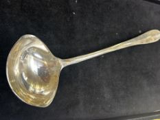 Early white metal ladle with rats tail design, tot