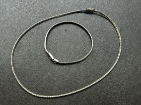 Silver necklace together with a matching bracelet