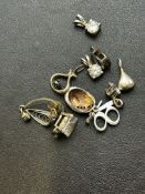 10 small silver pendants