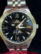 Astron calendar wristwatch dual colour case strap