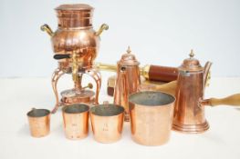 Collection of early copper measuring cups, heavy g